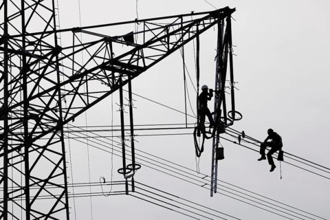 High voltage engineers working on high voltage pylons, Baden-Wuerttemberg