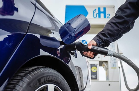 Passenger car refuels H2 hydrogen at a H2 hydrogen filling station, Herten