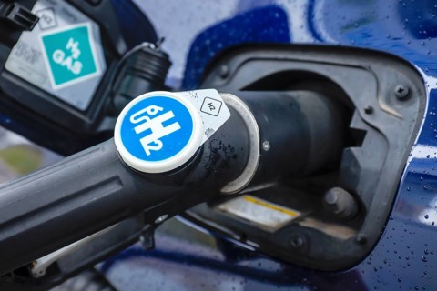 Passenger car refuels H2 hydrogen at a H2 hydrogen filling station, Herten