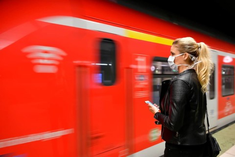 Woman with face mask, on mobile phone