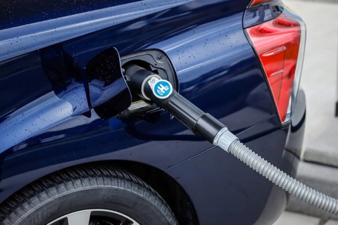 Passenger car refuels H2 hydrogen at a H2 hydrogen filling station, Herten