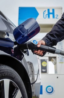 Passenger car refuels H2 hydrogen at a H2 hydrogen filling station, Herten