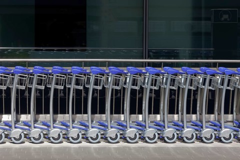 Long row of baggage trolleys at Duesseldorf airport, airport trolley