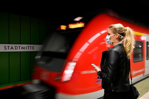 Woman with face mask, on mobile phone