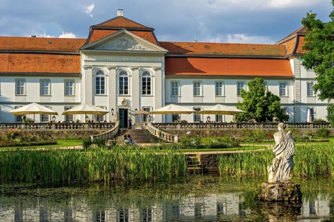 South facade at the palace garden with Venus statue in pond, baroque palace Fasanerie
