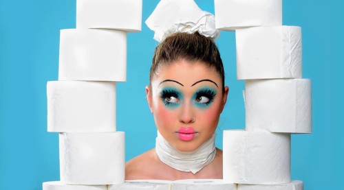 Young woman with toilet paper