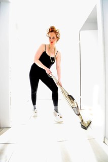 Woman vacuum cleaning