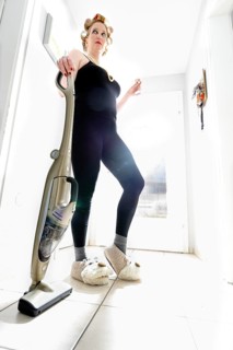 Woman vacuum cleaning