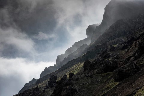 Clouds on rugged mountainside