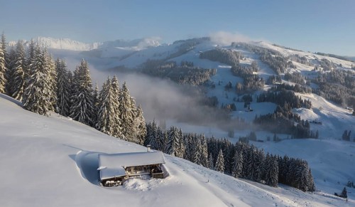 Snowy mountain hut in winter