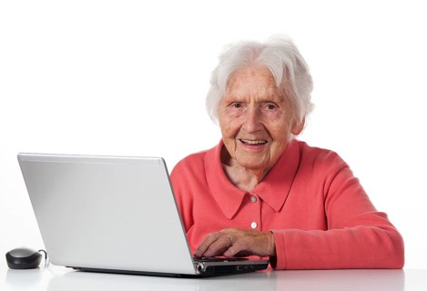 Senior sitting at the laptop