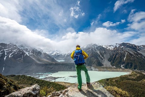 Hiker stands on rocks