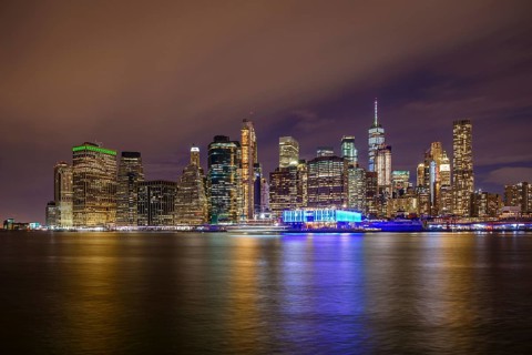 View from Pier 1 at night over the East River to the skyline of lower Manhattan
