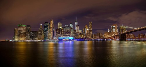View from Pier 1 at night over the East River to the skyline of lower Manhattan