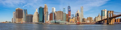 View from Pier 1 over the East River to the skyline of Lower Manhattan with Brooklyn Bridge