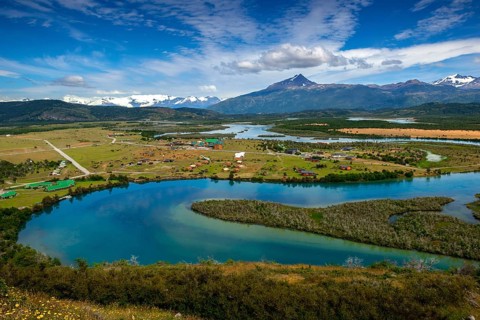 View of the Torres del Paine National Park and the Rio Serrano River to the settlement of Villa Rio Serrano