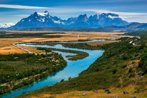 View of the mountain range Cuernos del Paine over the river Rio Serrano