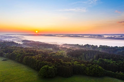 Sunrise and early morning fog over Isar valley near Icking