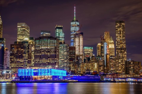 View from Pier 1 at night over the East River to the skyline of lower Manhattan
