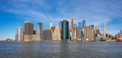 View from Pier 1 over the East River to the skyline of Lower Manhattan with Brooklyn Bridge