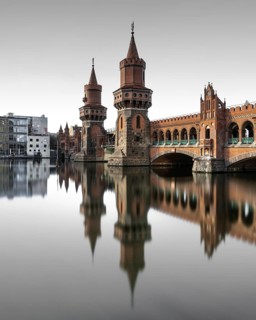 Berlin Oberbaum Bridge at Warschauer Strasse in Berlin with reflection in the Spree