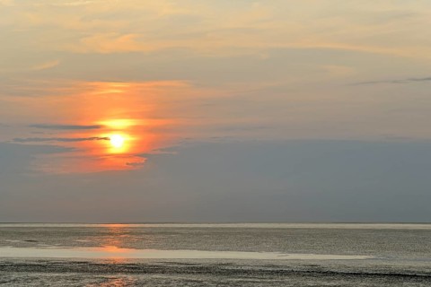 Sunset at the Wadden Sea at low tide