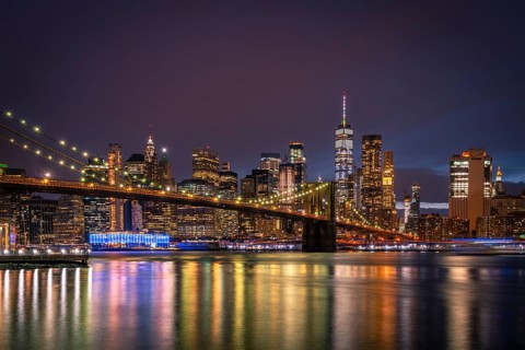 View from Main Street Park at night over the East River to the skyline of lower Manhattan