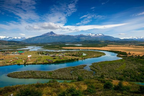 View of the Torres del Paine National Park and the Rio Serrano River to the settlement of Villa Rio Serrano