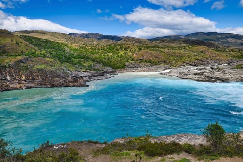 Rapids at the confluence of blue Baker river and grey Neff river
