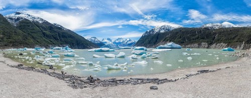Glacial lake with small icebergs floating