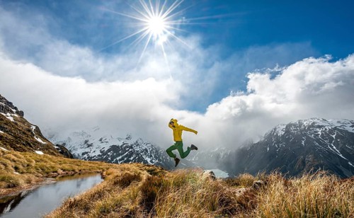 Hiker jumps into the air