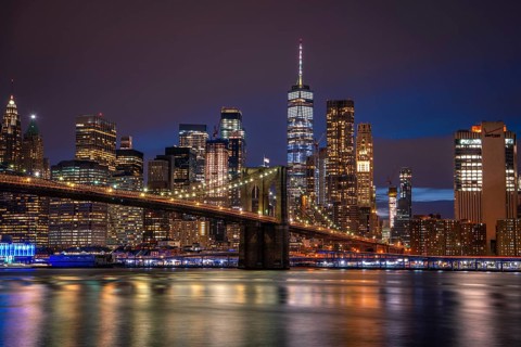 View from Main Street Park at night over the East River to the skyline of lower Manhattan