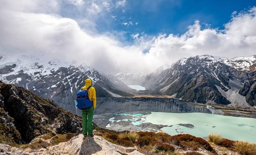 Hiker stands on rocks
