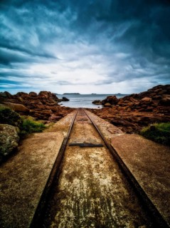 Rusty tracks into the sea