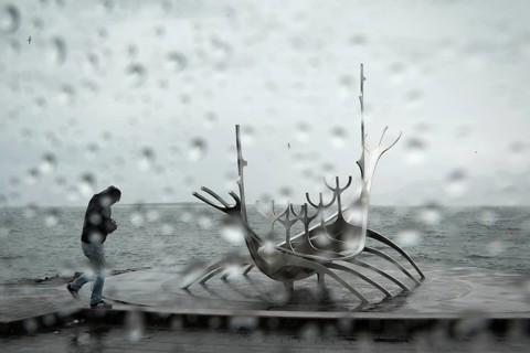 Tourist in rain at the sun ship