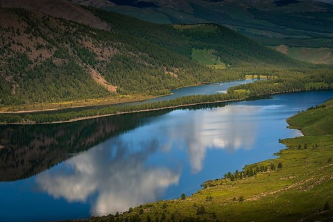 Reflection of cloudy sky in the Shireet lake