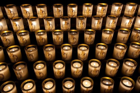 Many burning sacrificial candles