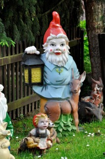 Garden gnome with lantern and deer
