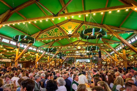 Guests sit comfortably in the festival tent