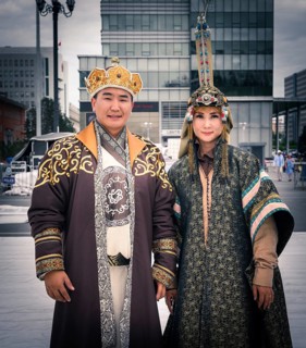 Mongolian family is posing in traditional costumes during the DEEL