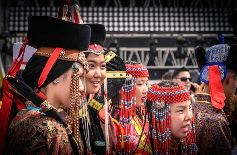 Young ladies in Mongolian traditional costumes at the Central square