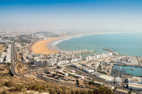 Modern architecture and sandy beach in Agadir