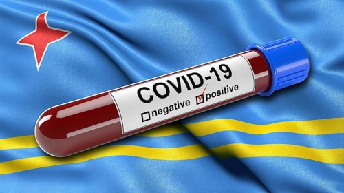 Flag of French Polynesia waving in the wind with a positive Covid-19 blood tube