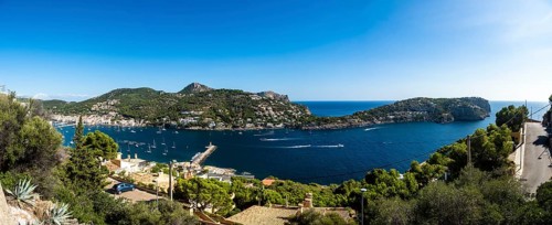 Coast and natural harbour with boats and fish farming