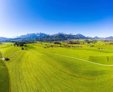 Villages in cultural landscape in front of the Tannheimer Berge with Hohe Schlicke