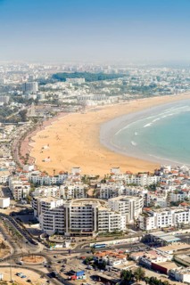 Modern architecture and sandy beach in Agadir