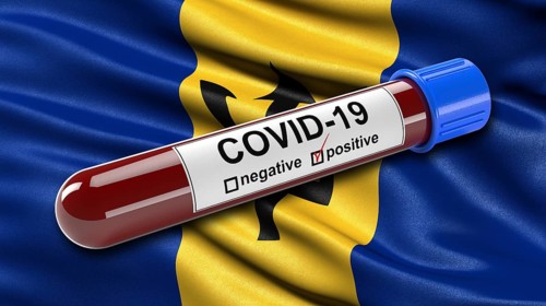 Flag of Barbados waving in the wind with a positive Covid-19 blood tube