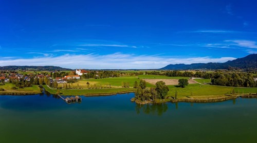 Aerial view of Schlehdorf Monastery with St. Tertulin Parish Church at Lake Lake Kochel