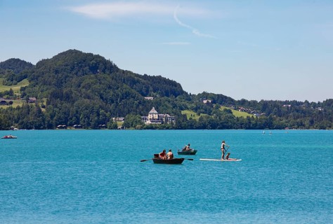 Boats at the Fuschlsee with castle Fuschl