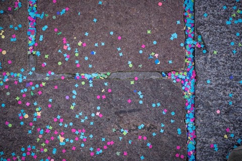 Colourful confetti after a carnival procession in the street